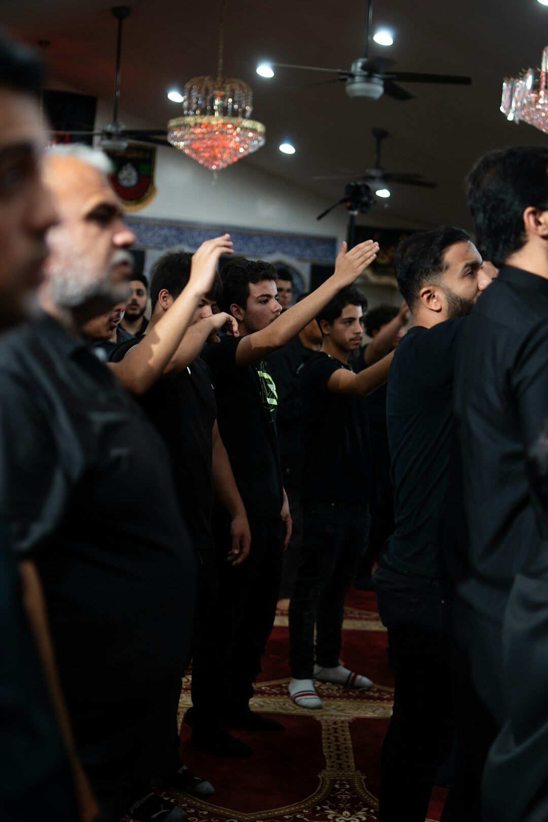 Diverse group of Turkish trainers and staff posing together indoors